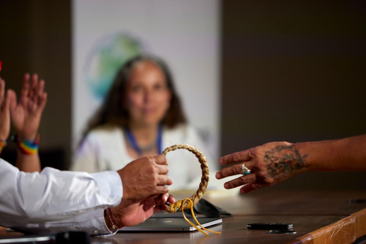 Participants exchange gifts at the World Summit of Indigenous Peoples and Nature