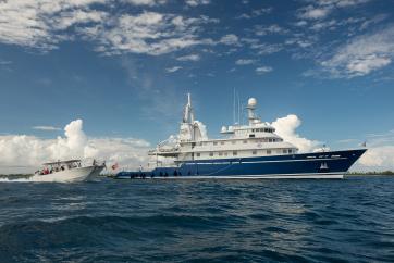 The Global Reef Expedition circumnavigated the globe over the course of ten years to address the coral reef crisis aboard the M/Y Golden Shadow, pictured here with dive vessel, the Calcutta. © Michele Westmorland /iLCP